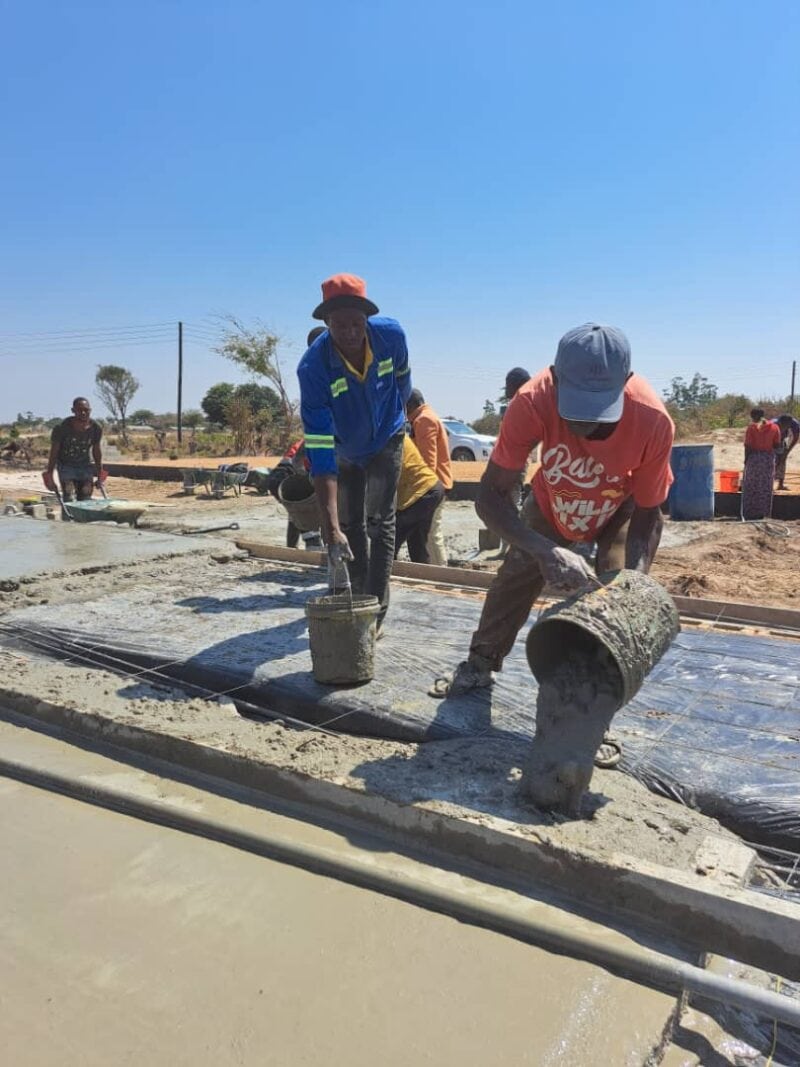 Pouring cement by hand