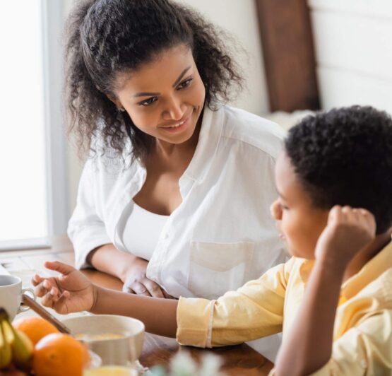 Mom and Son Talking at Table